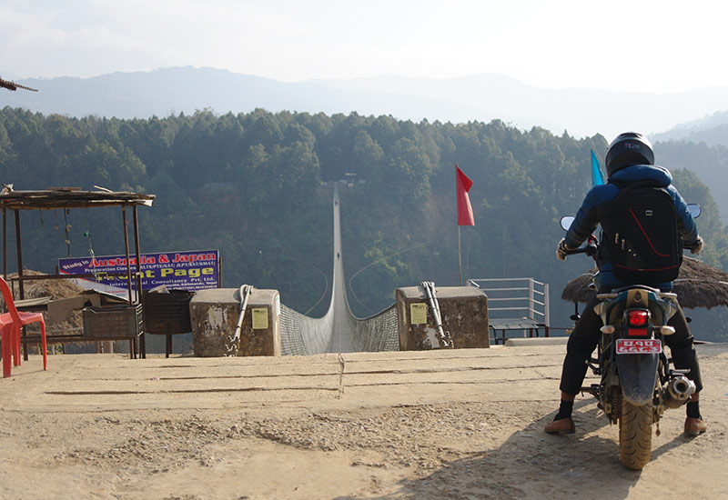 nepal-motorbike-crossing-bridge-in-kusma