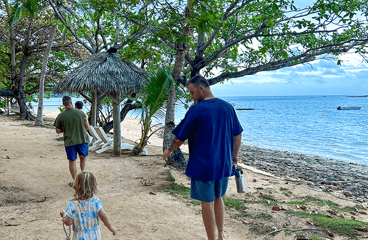 Mark and Dave walking with Zoey and Issy at Malolo Island Resort