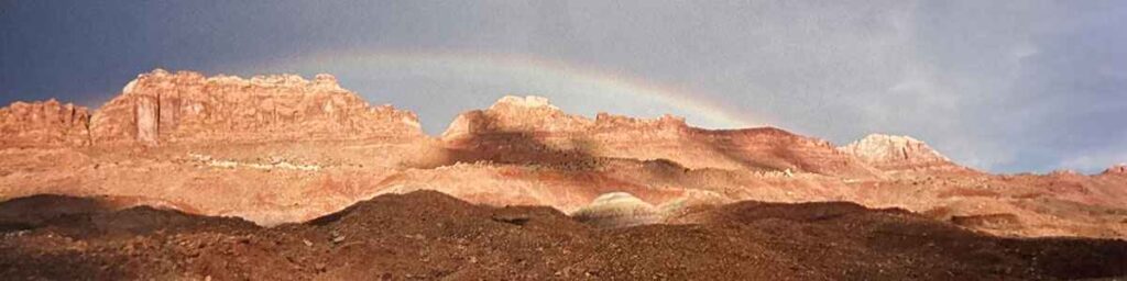 A rainbow appears after a storm in the USA desert.
